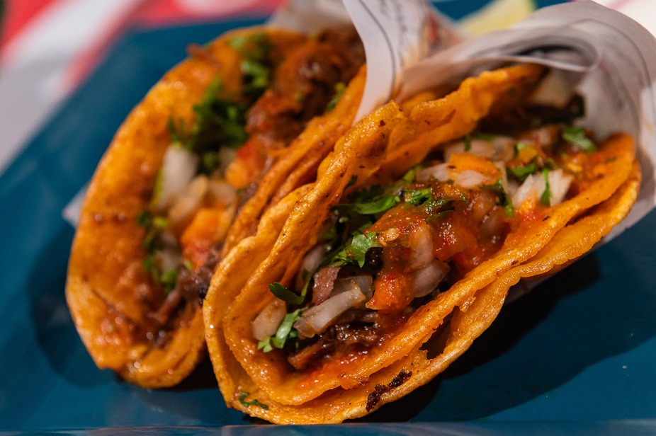 Quesabirria tacos griddled orange, close up