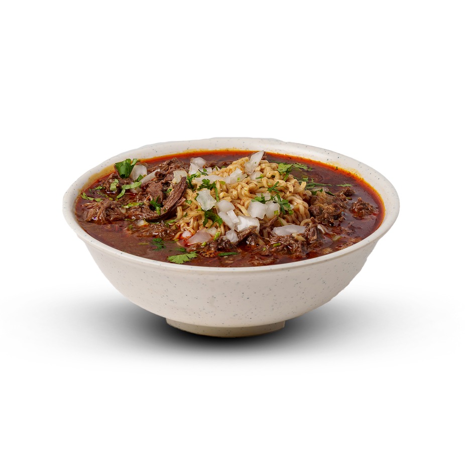 Ramen birria bowl: noodles in dark red birria broth with onion and cilantro
